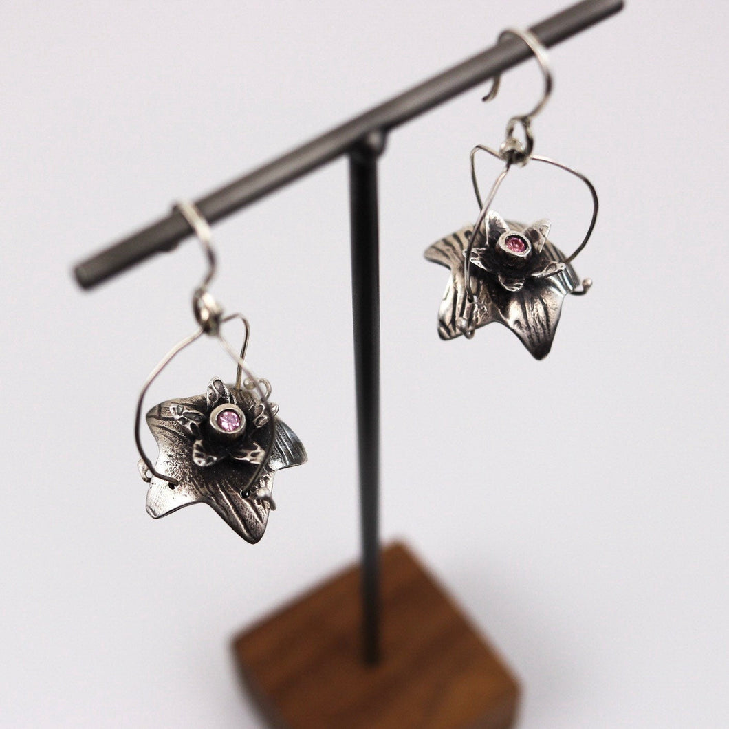 Fine silver Flower Drop earrings with pink CZ’s on a sterling silver ear wires.
